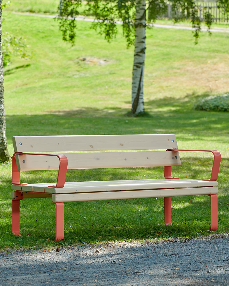 A park bench with a backrest.